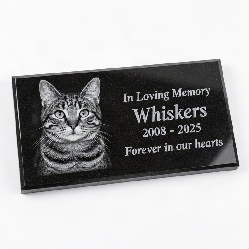 Thin polished black granite grave marker tile with laser-engraved grayscale cat portrait, name, dates, and In Loving Memory text with Forever in our hearts message