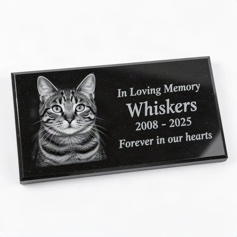 Thin polished black granite grave marker tile with laser-engraved grayscale cat portrait, name, dates, and In Loving Memory text with Forever in our hearts message