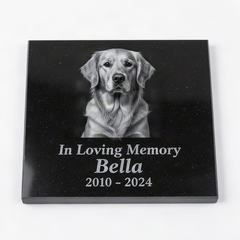 Thin polished black granite tile with laser-engraved grayscale portrait of a dog, name, dates, and In Loving Memory text