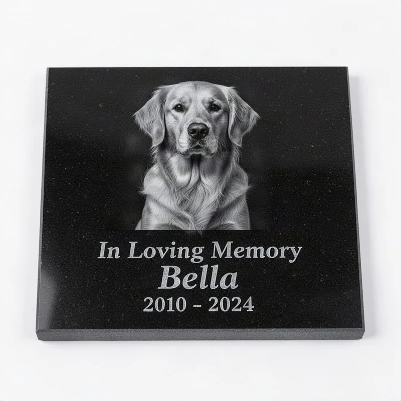 Thin polished black granite tile with laser-engraved grayscale portrait of a dog, name, dates, and In Loving Memory text