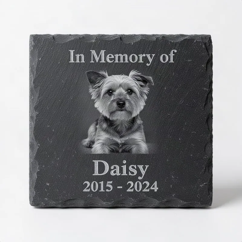 Dark grey slate tile with laser-engraved grayscale portrait of a small dog, name, dates, and In Memory of text