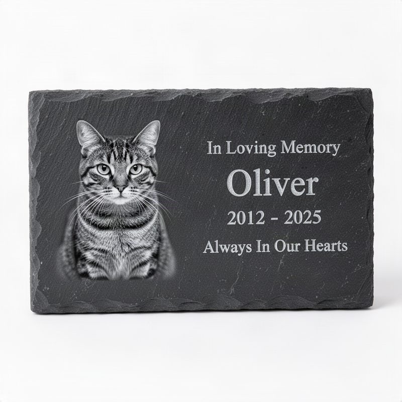Dark grey slate garden marker with laser-engraved grayscale cat portrait, name, dates, and Always In Our Hearts message