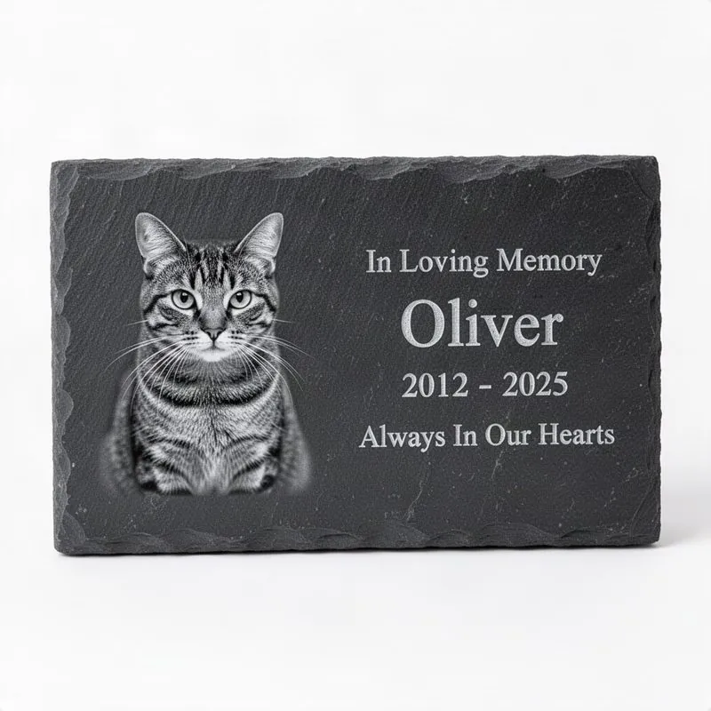 Dark grey slate garden marker with laser-engraved grayscale cat portrait, name, dates, and Always In Our Hearts message